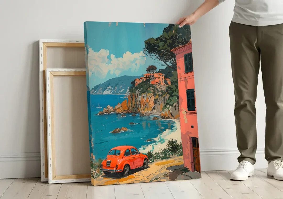Red Car Painting on the Italian Coast canvas wall art leaning against a wall next to blank canvases