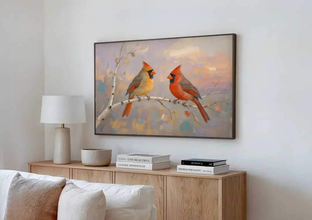 Winter Red Cardinal Pair on Twilight Birch canvas wall art above a wooden sideboard next to a sofa