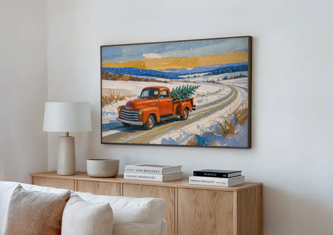 Red Truck Christmas Tree Painting on Country Road canvas wall art above a wooden sideboard next to a sofa