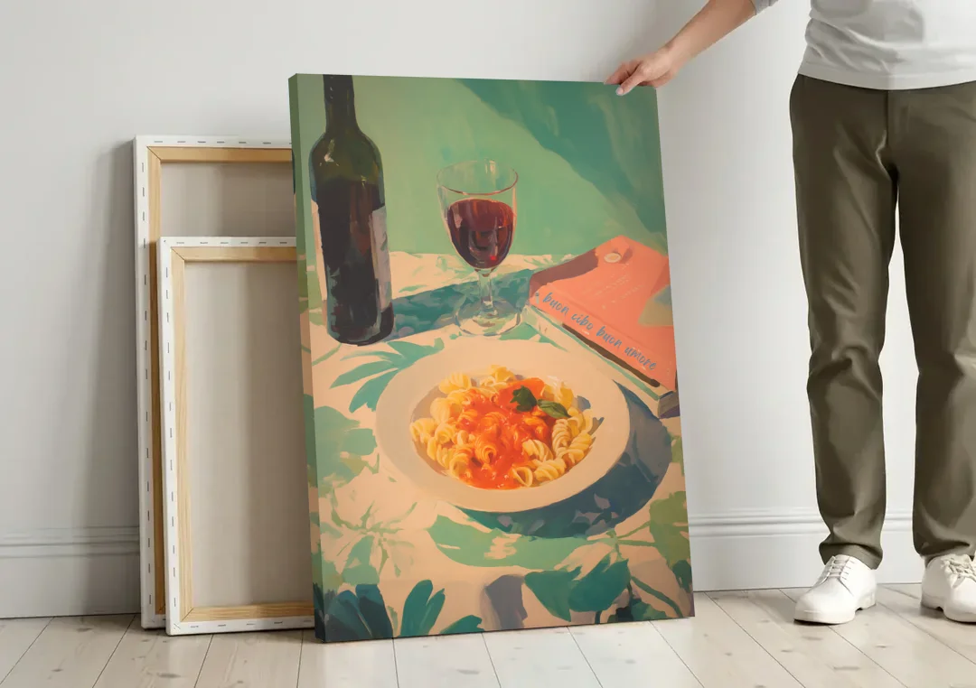 Red Wine Painting with Pasta and a Book canvas wall art leaning against a wall next to blank canvases