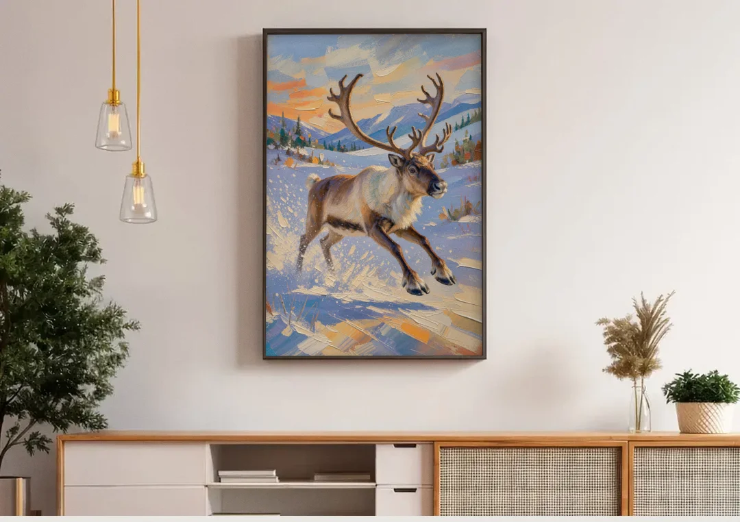 Reindeer in Snow Painting at Full Gallop canvas wall art above a wooden sideboard under pendant lights