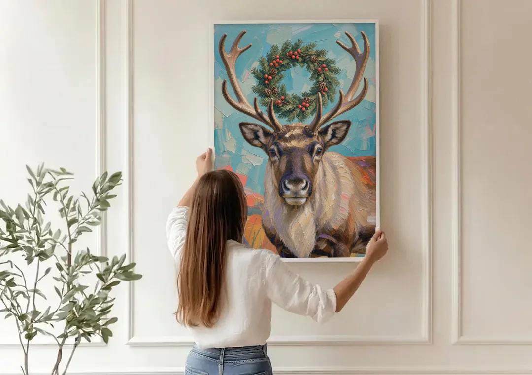 Reindeer with Evergreen Wreath on Antlers canvas wall art being hung on a paneled wall