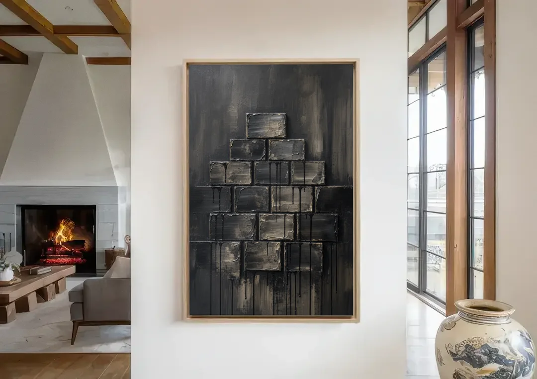 Relief Wall Art of Stacked Charcoal Blocks canvas wall art in a living room with a fireplace