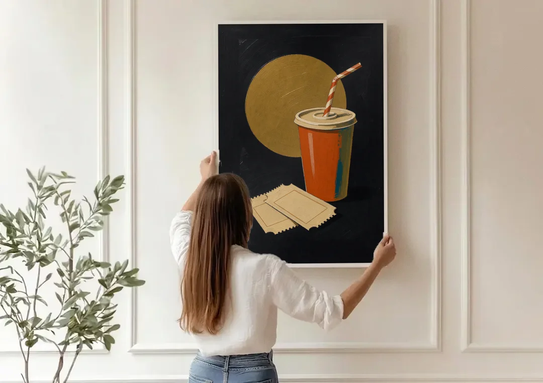 Retro Movie Wall Art with Soda and Tickets canvas wall art being hung on a paneled wall