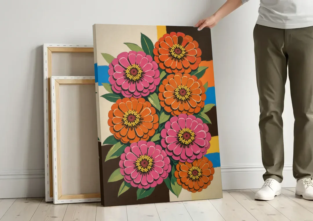 Retro Pink and Orange Zinnia Cluster canvas wall art leaning against a wall next to blank canvases