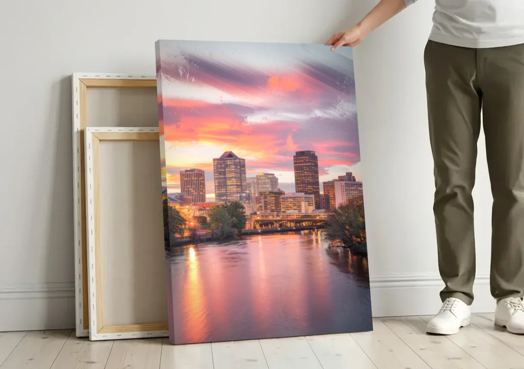 Richmond Skyline Sunset canvas wall art leaning against a wall next to blank canvases