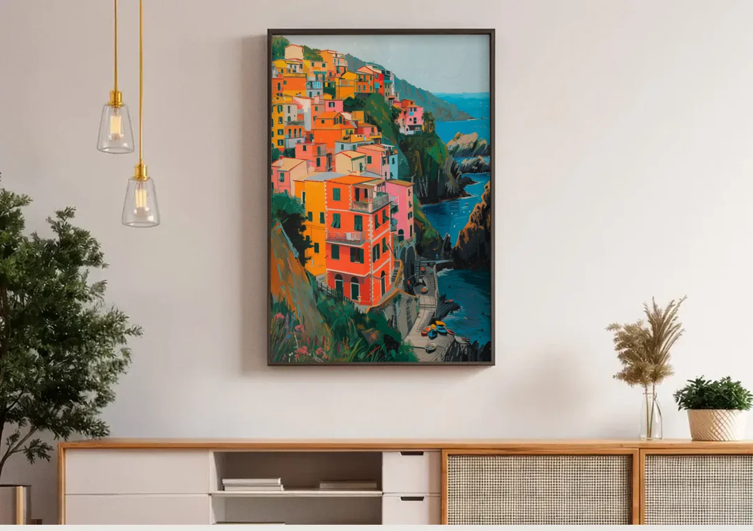Riomaggiore Painting Above the Sea canvas wall art above a wooden sideboard under pendant lights