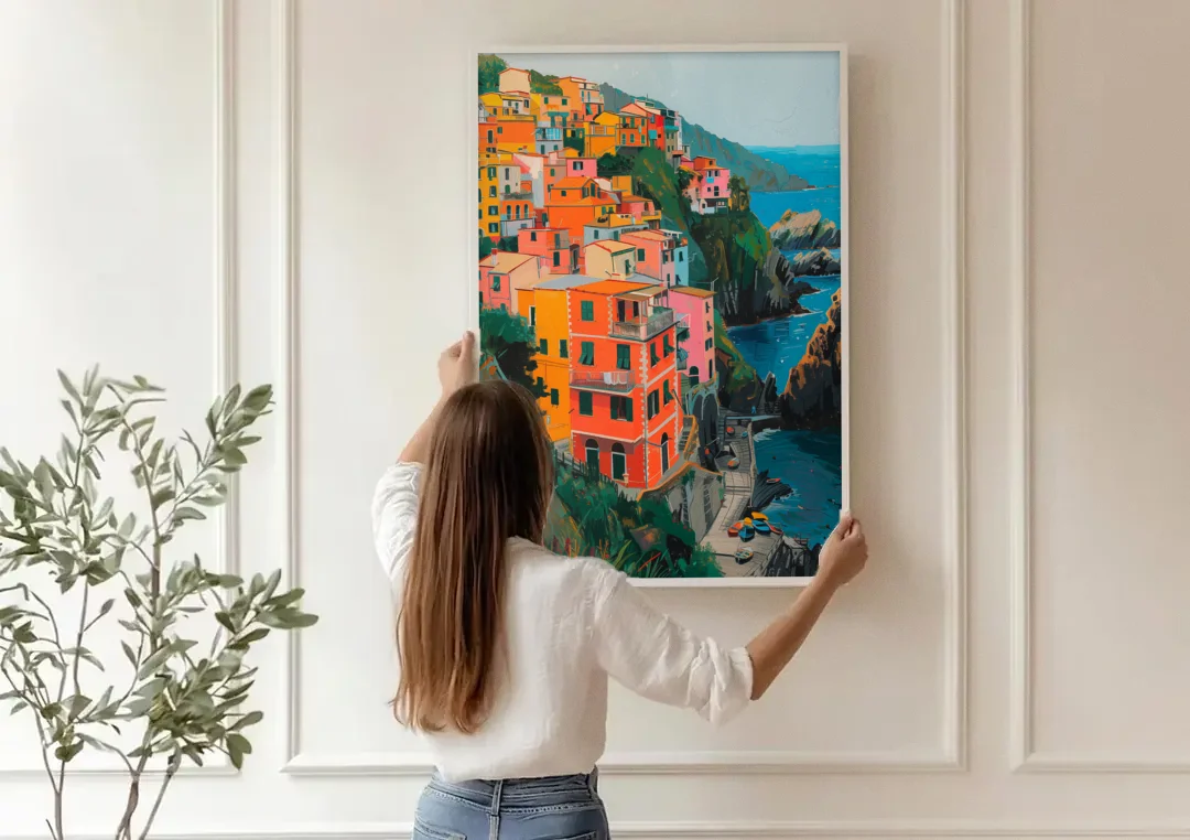 Riomaggiore Painting Above the Sea canvas wall art being hung on a paneled wall