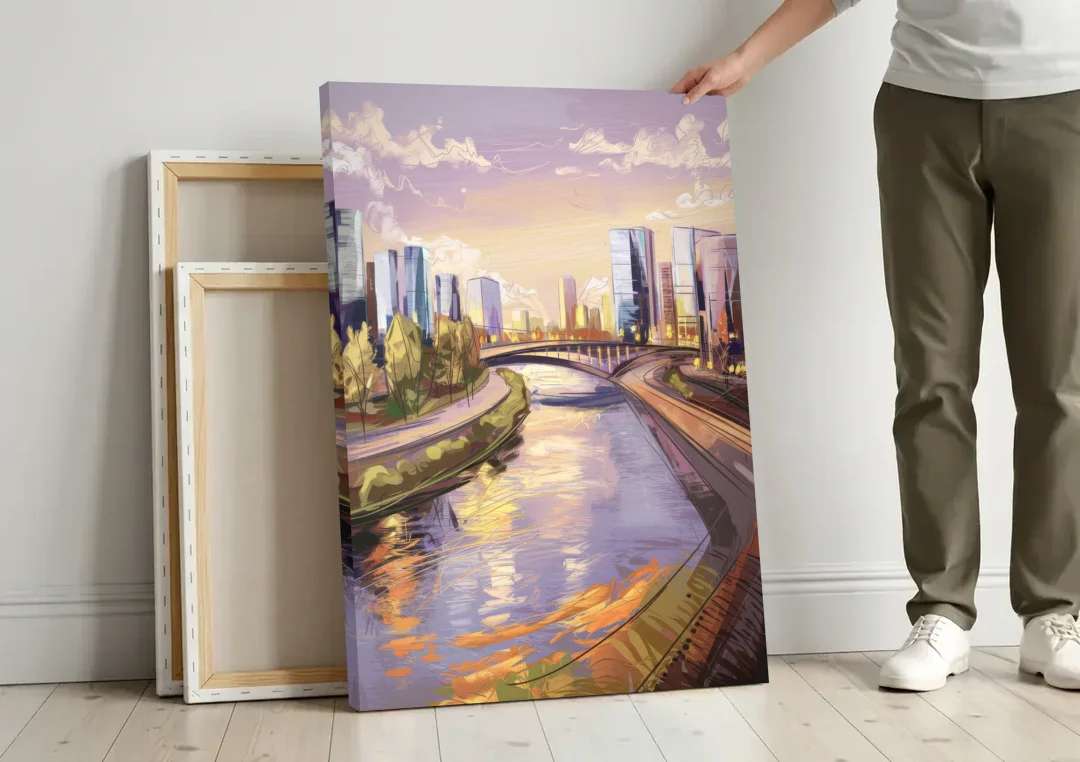Riverside Urban Landscape canvas wall art leaning against a wall next to blank canvases