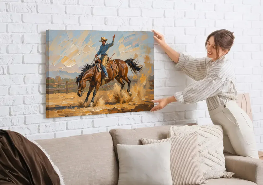 Rodeo Wall Art of the Bucking Bronco canvas wall art being hung on a white brick wall above a sofa