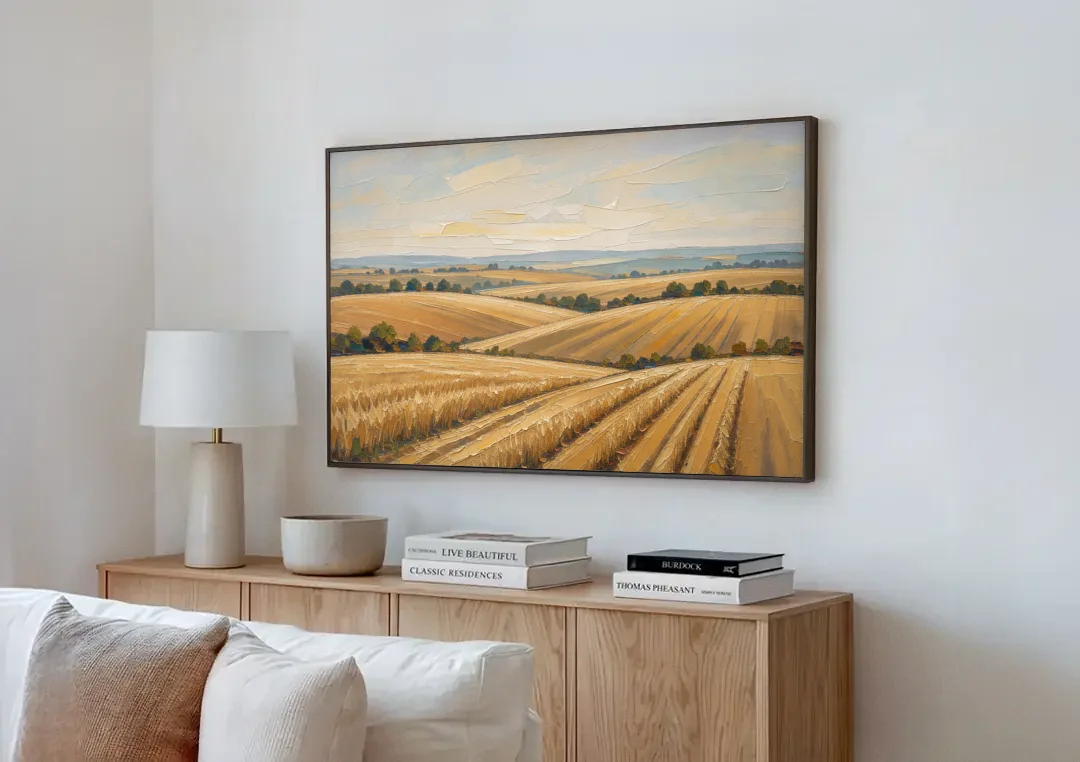Rolling Hills Landscape Painting in Harvest Gold canvas wall art above a wooden sideboard next to a sofa