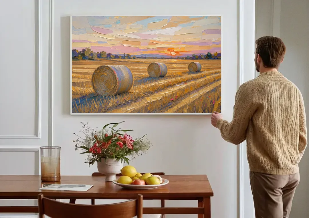 Round Hay Bales on a Golden Harvest Field canvas wall art above a dining table