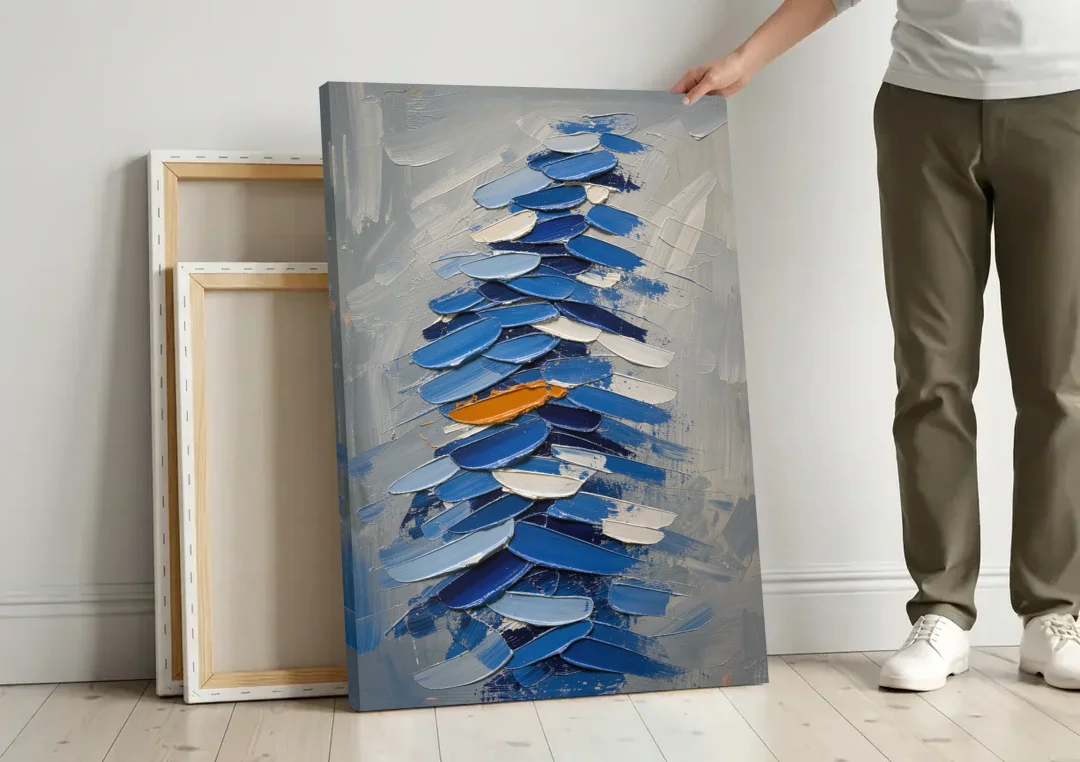 Royal Blue Abstract Painting of Stacked Knife Strokes canvas wall art leaning against a wall next to blank canvases