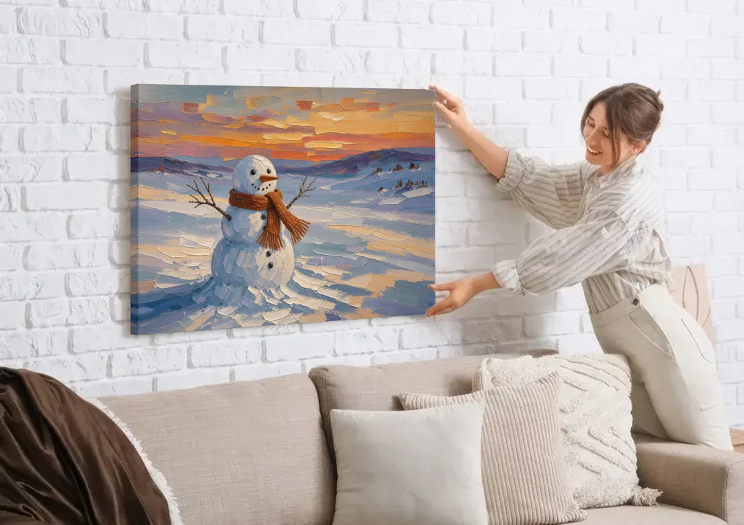 Rust Scarf Snowman at Dusk in Winter canvas wall art being hung on a white brick wall above a sofa