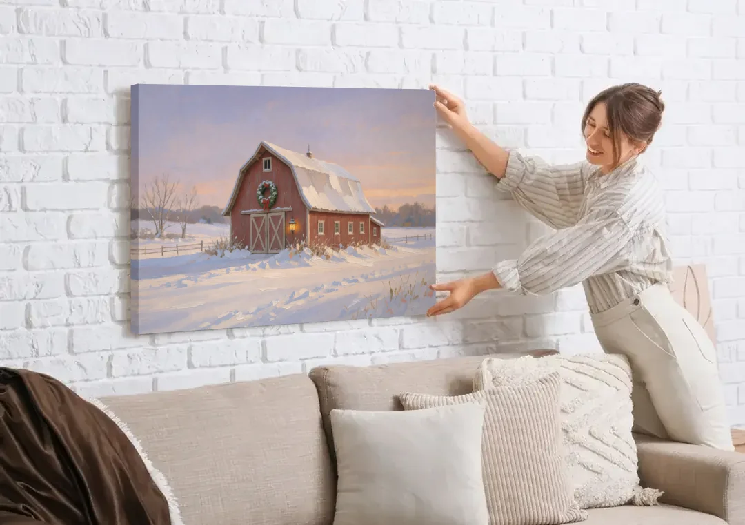 Rustic Christmas Wall Decor Red Barn at Dusk canvas wall art being hung on a white brick wall above a sofa