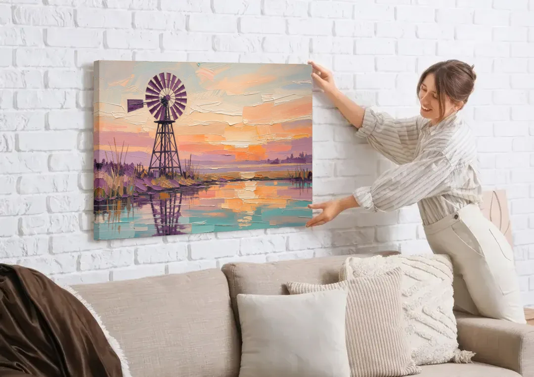 Rustic Wall Decor with a Windmill at Sunset canvas wall art being hung on a white brick wall above a sofa