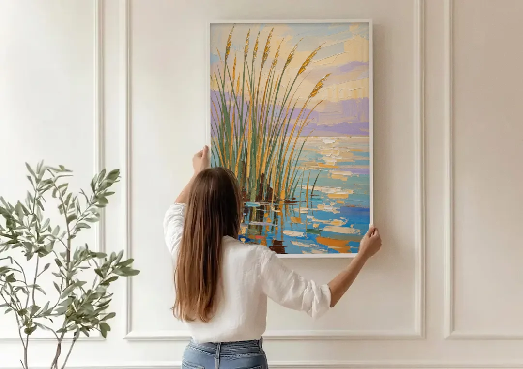 Sage and Ochre Reeds on Still Water canvas wall art being hung on a paneled wall
