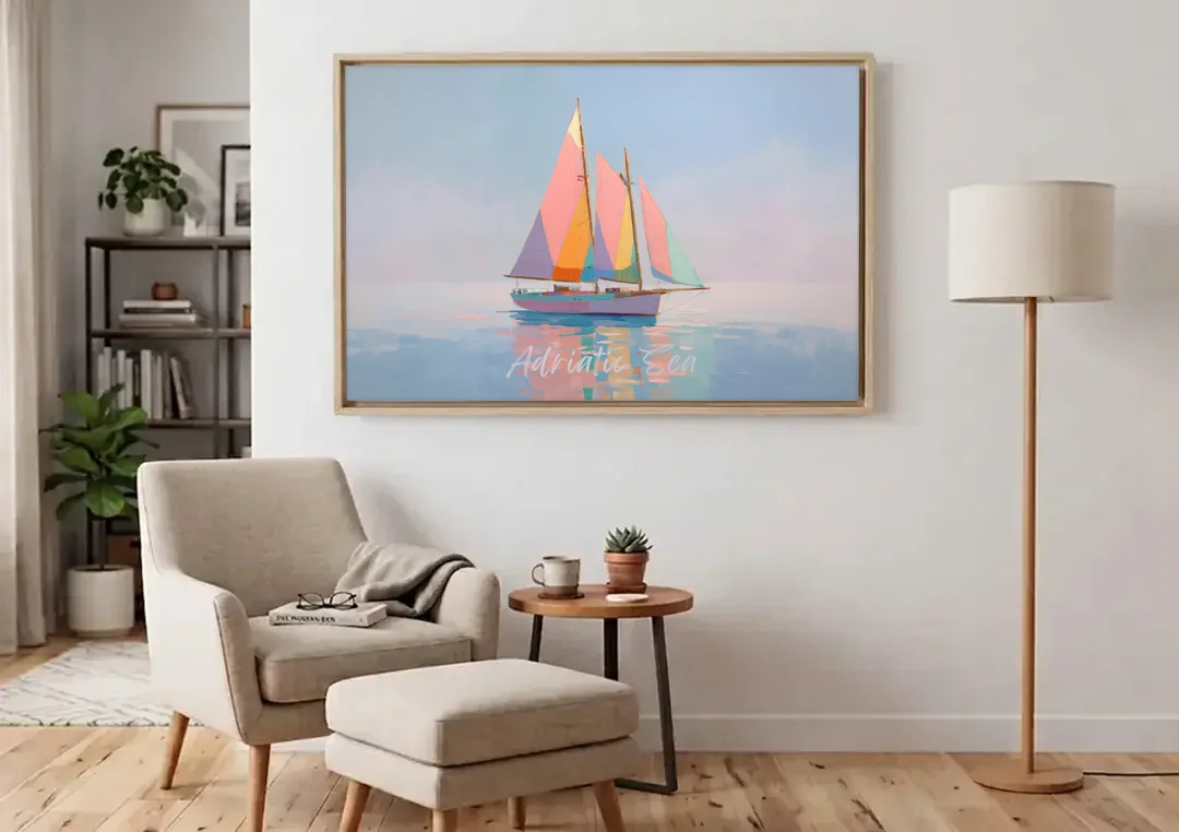 Sailboat Painting in Soft Pastels canvas wall art above an armchair in a bright living room