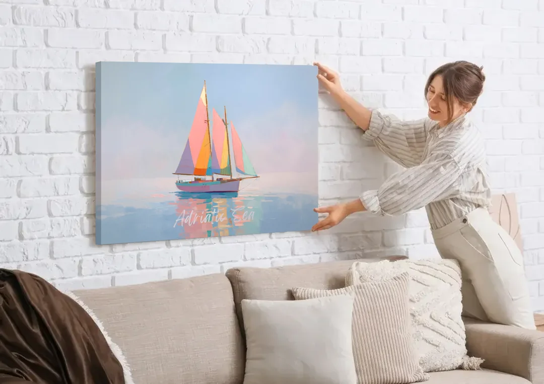 Sailboat Painting in Soft Pastels canvas wall art being hung on a white brick wall above a sofa