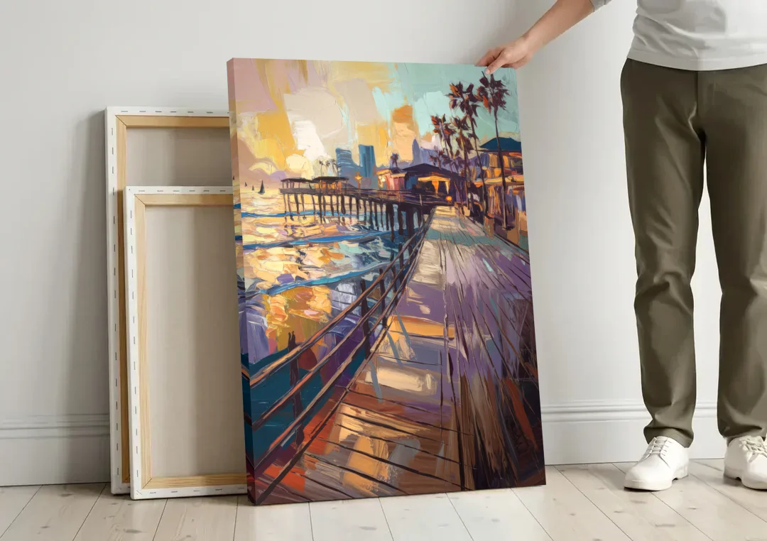 San Diego Boardwalk Scenes canvas wall art leaning against a wall next to blank canvases