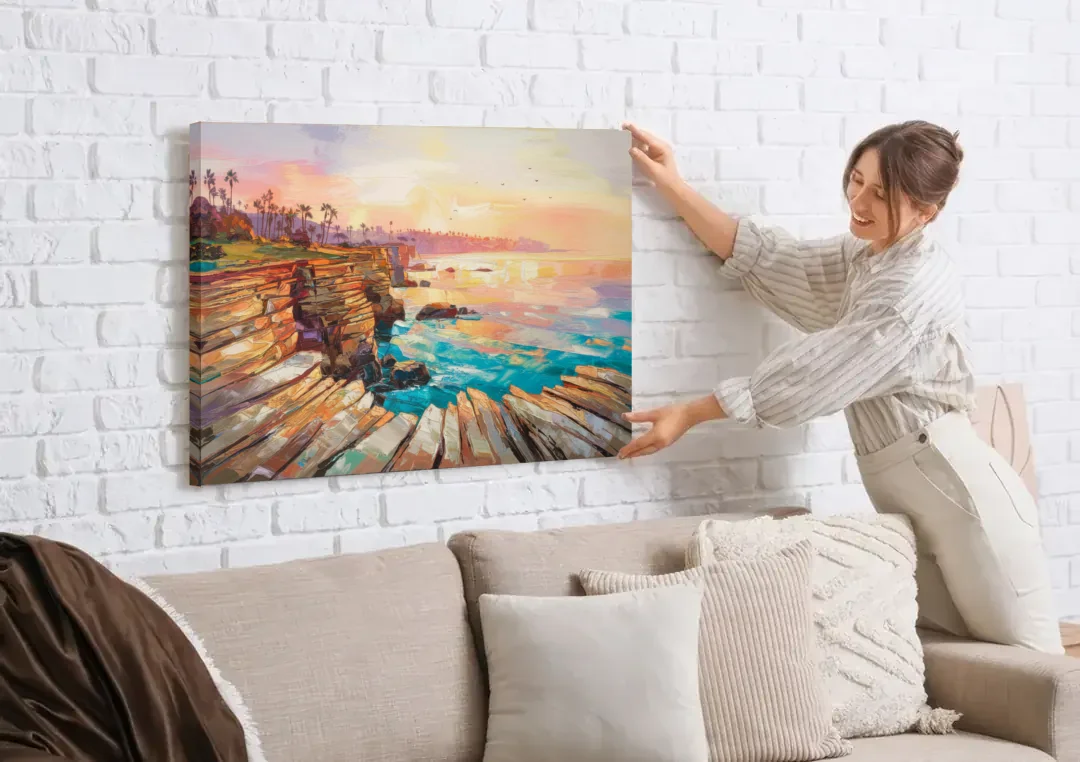 San Diego Coastal Cliffs canvas wall art being hung on a white brick wall above a sofa