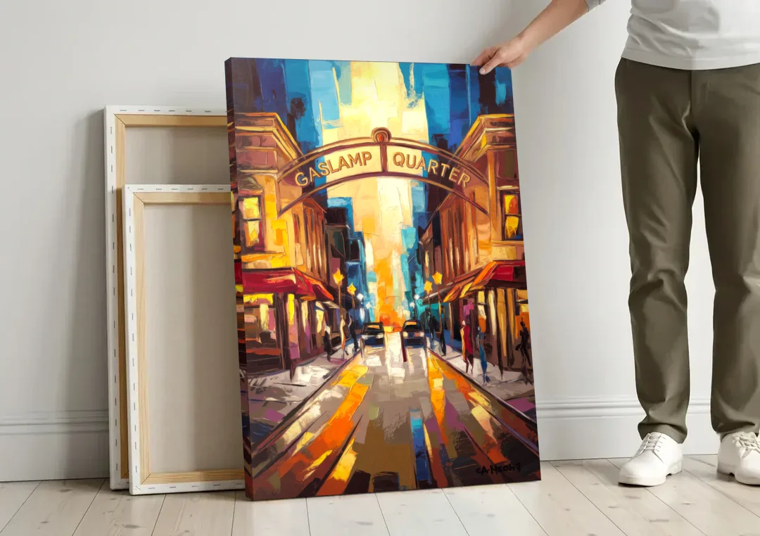 San Diego Historic Gaslamp District canvas wall art leaning against a wall next to blank canvases