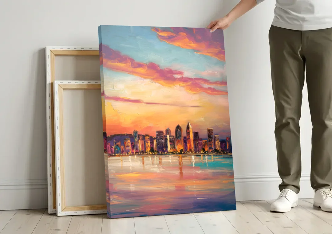San Diego Skyline Sunset canvas wall art leaning against a wall next to blank canvases
