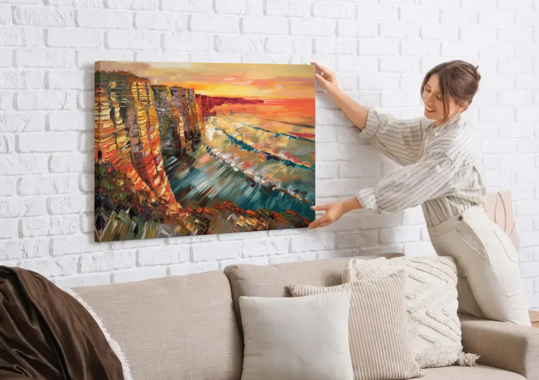 San Diego Sunset Cliffs canvas wall art being hung on a white brick wall above a sofa
