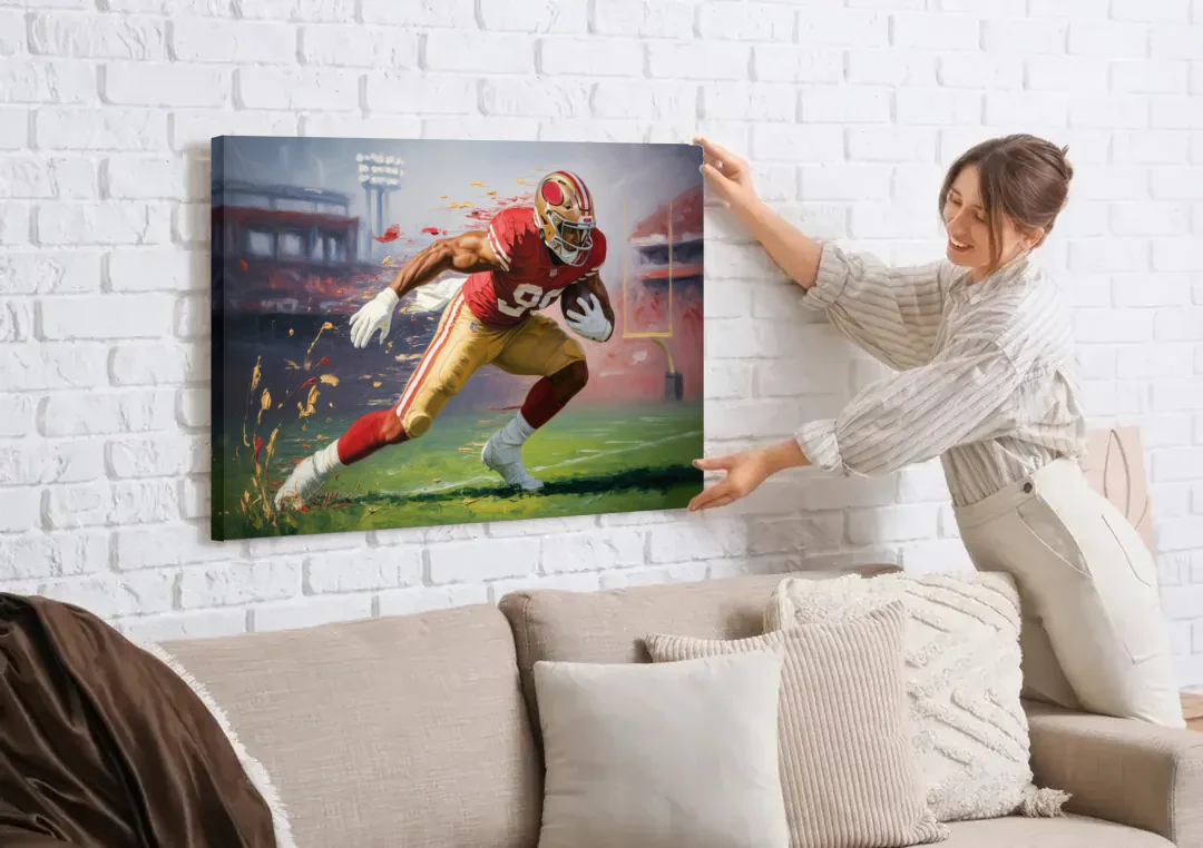 San Francisco 49ers Dynamic Impressionistic Action Art canvas wall art being hung on a white brick wall above a sofa