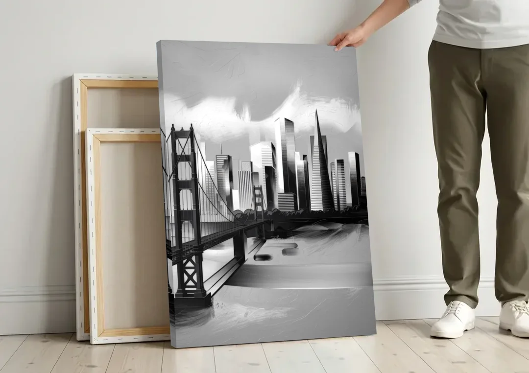 San Francisco Black and White Skyline canvas wall art leaning against a wall next to blank canvases