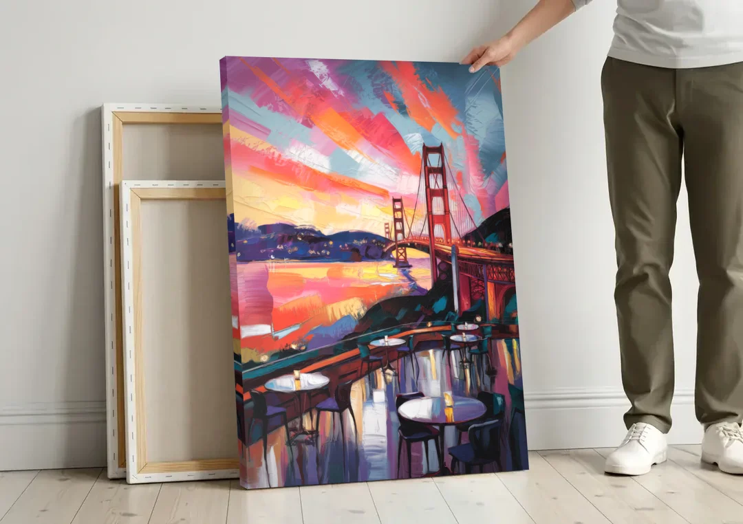 San Francisco Sunset Over the Bay canvas wall art leaning against a wall next to blank canvases