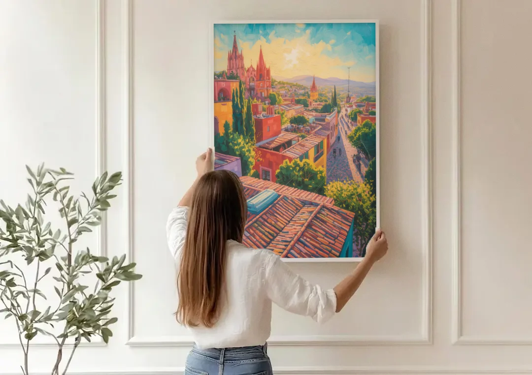San Miguel Rooftops canvas wall art being hung on a paneled wall