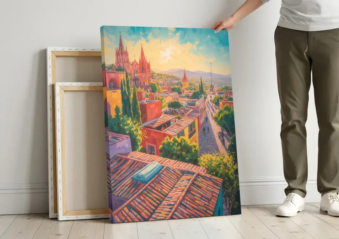 San Miguel Rooftops canvas wall art leaning against a wall next to blank canvases