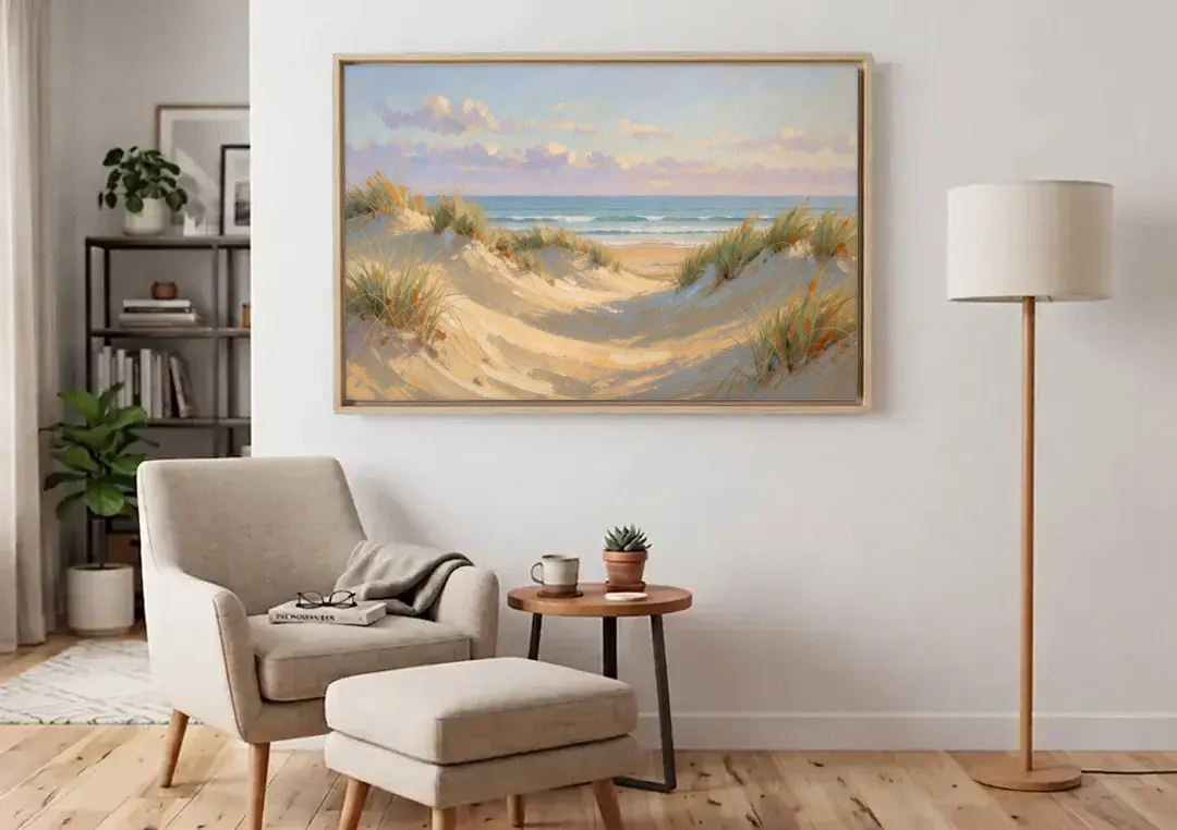 Sand Dunes and Beach Grass Under Lavender Clouds canvas wall art above an armchair in a bright living room