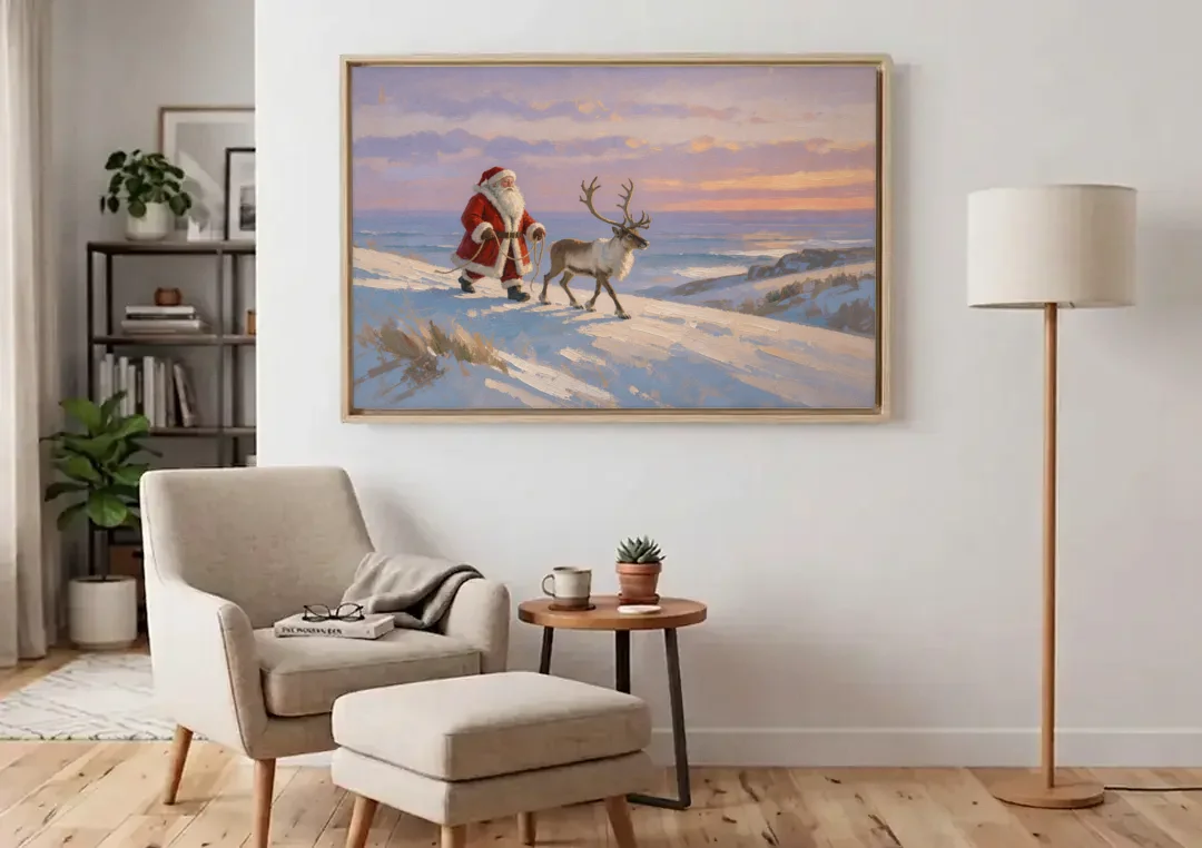 Christmas Santa and Reindeer at Twilight canvas wall art above an armchair in a bright living room