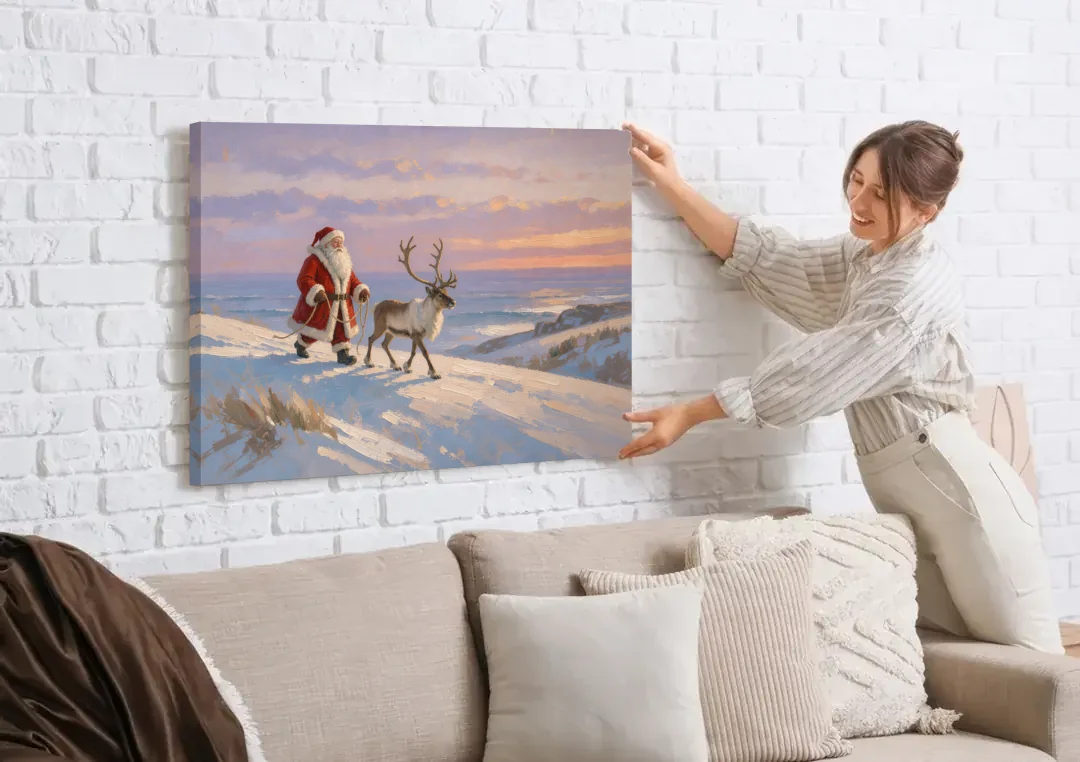 Christmas Santa and Reindeer at Twilight canvas wall art being hung on a white brick wall above a sofa
