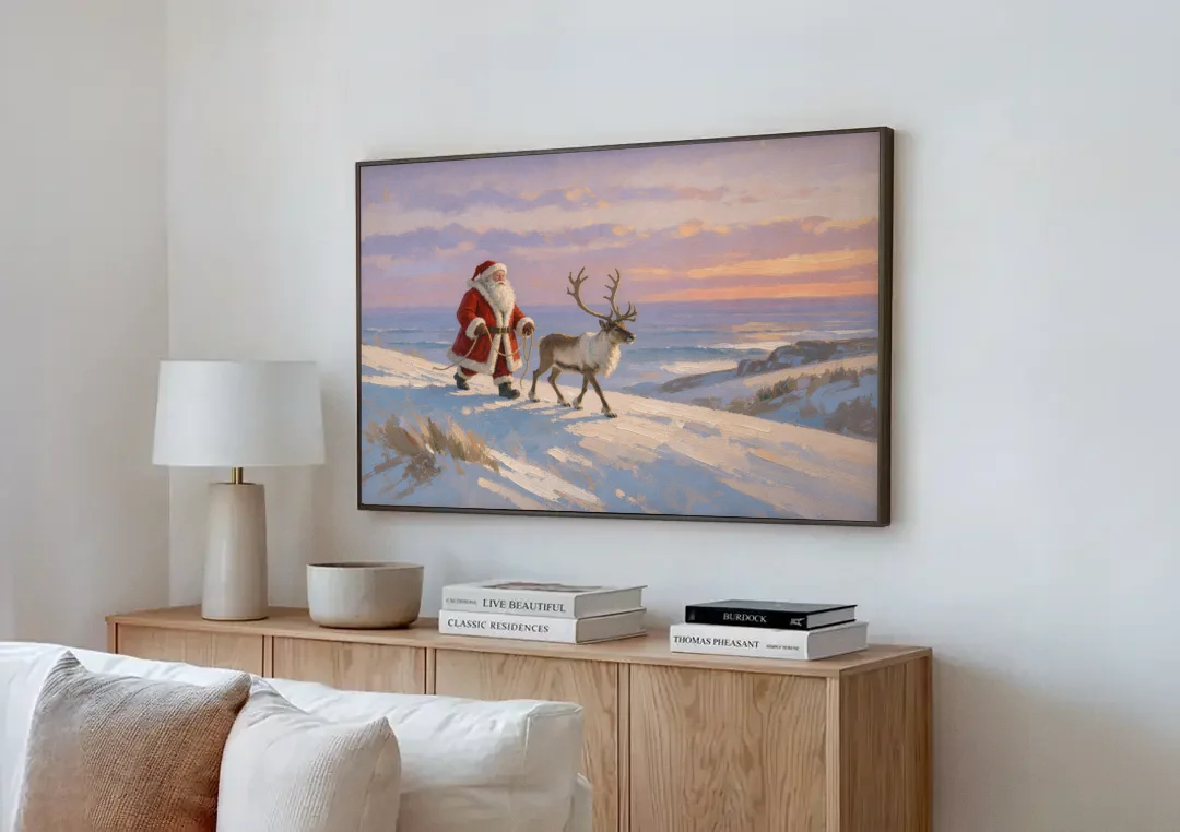 Christmas Santa and Reindeer at Twilight canvas wall art above a wooden sideboard next to a sofa