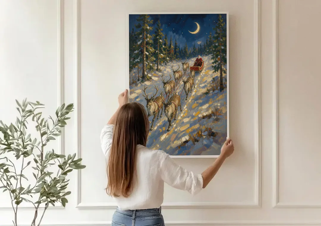 Santa and Reindeer Canvas Climbing to the Crescent Moon canvas wall art being hung on a paneled wall