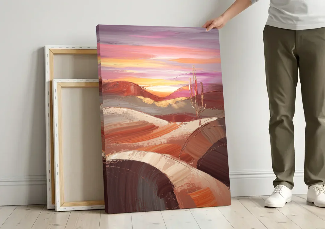 Santa Fe Desert Sunrise canvas wall art leaning against a wall next to blank canvases