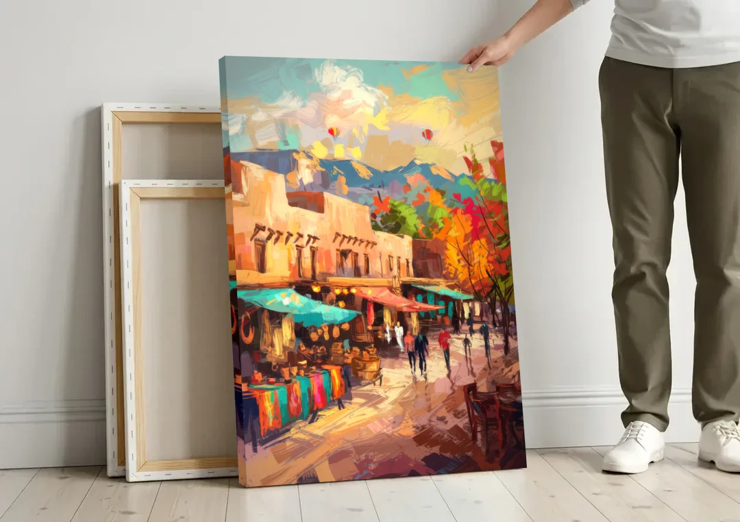 Santa Fe Historic Plaza canvas wall art leaning against a wall next to blank canvases
