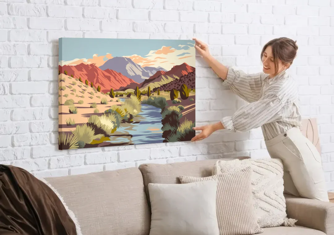 Santa Fe Mountain View canvas wall art being hung on a white brick wall above a sofa