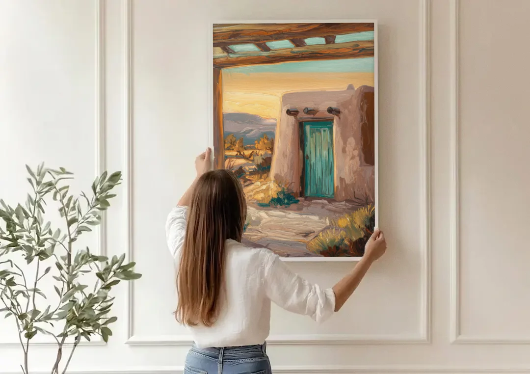 Santa Fe Pueblo Style canvas wall art being hung on a paneled wall