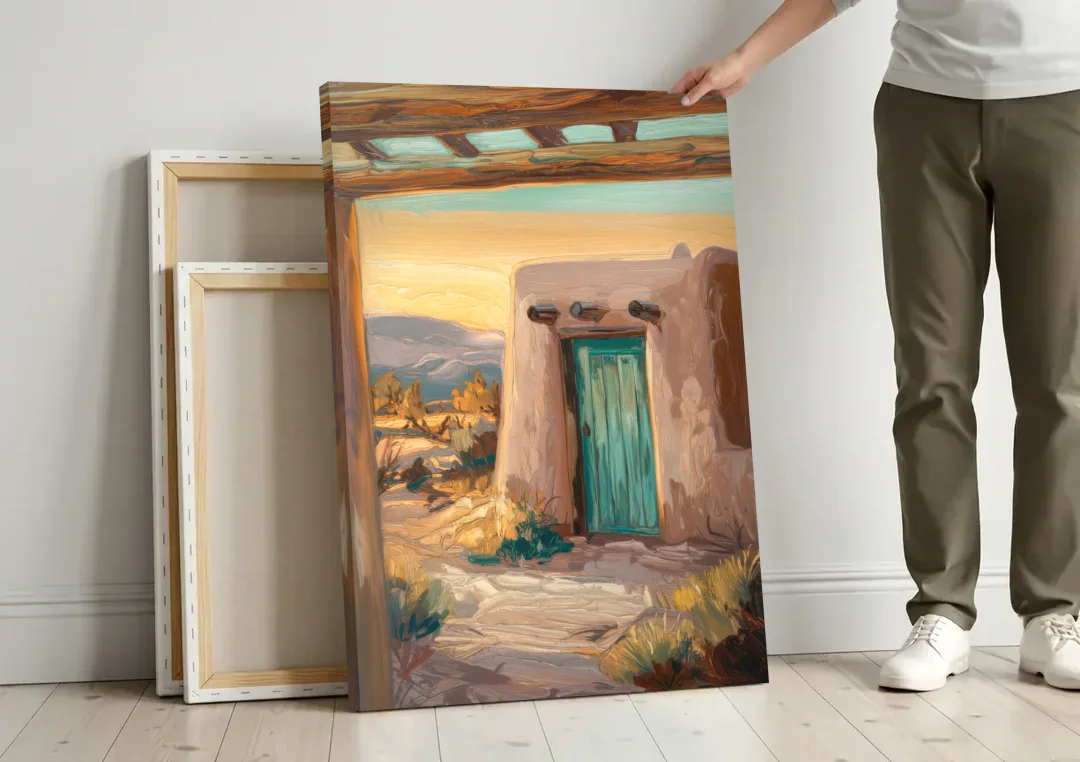 Santa Fe Pueblo Style canvas wall art leaning against a wall next to blank canvases