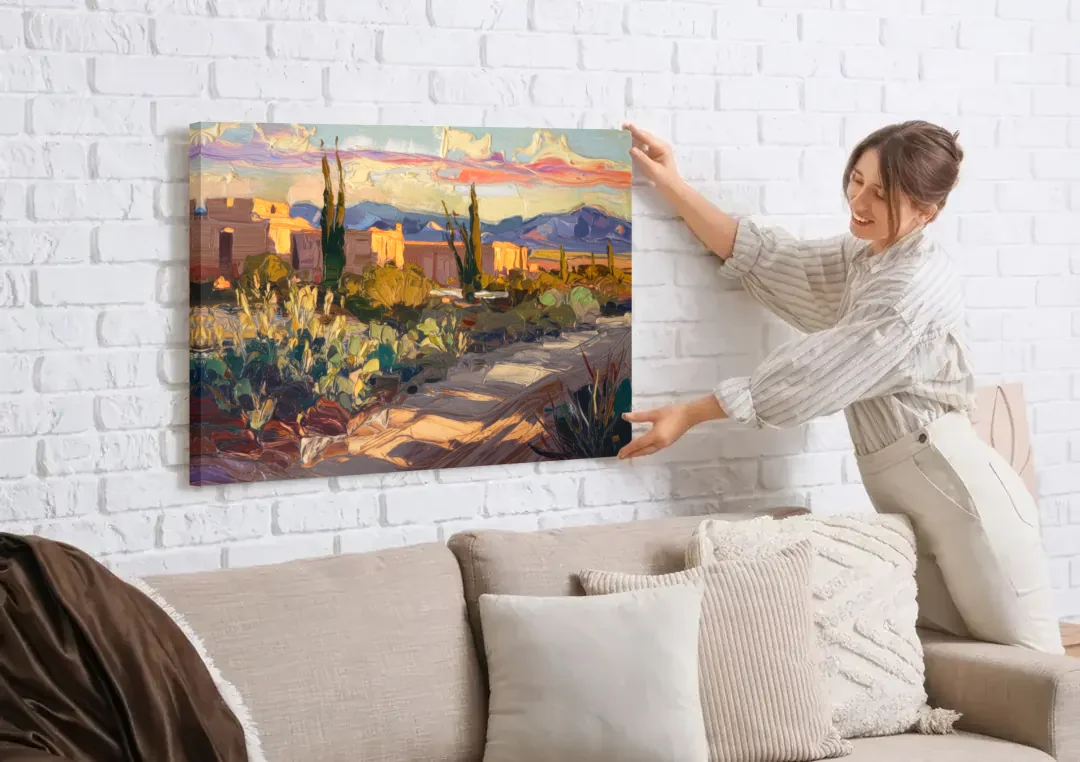 Santa Fe Sunset Landscape canvas wall art being hung on a white brick wall above a sofa
