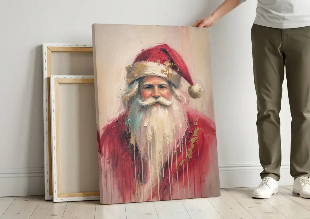 Abstract Christmas Santa in Gold Drips canvas wall art leaning against a wall next to blank canvases