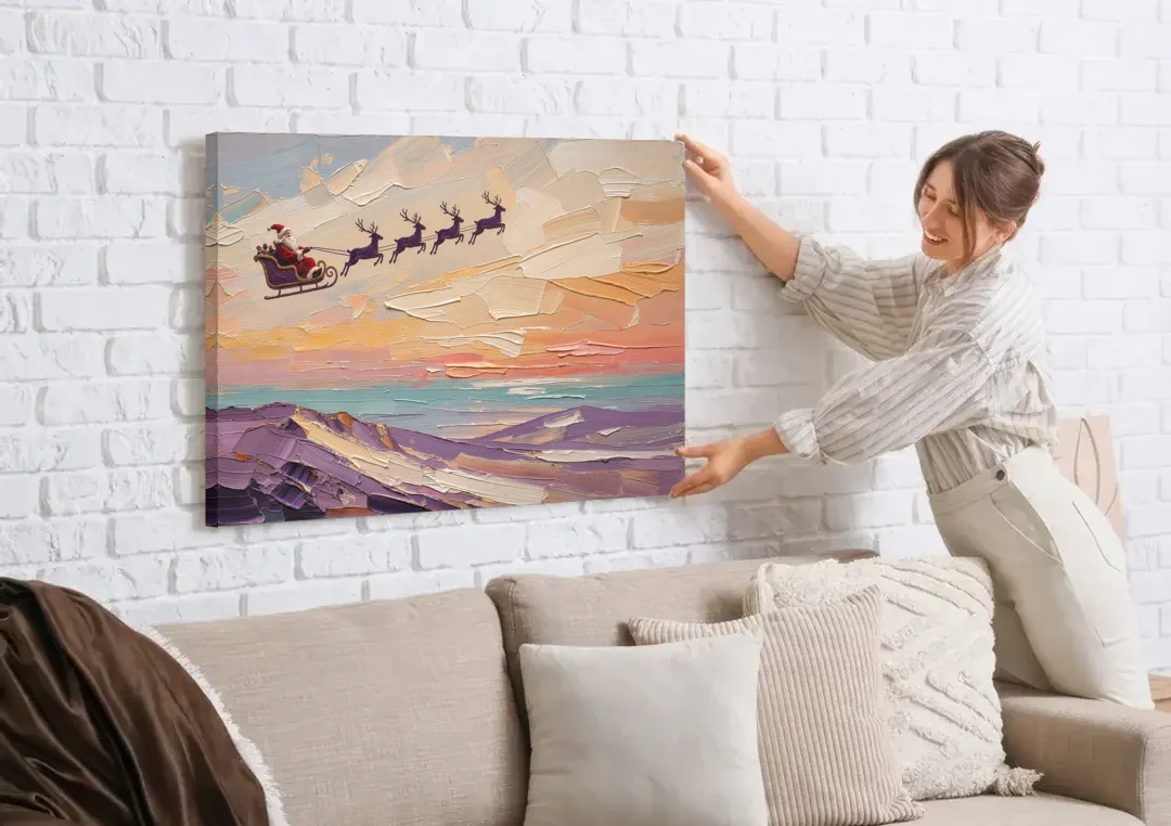 Santa Sleigh Painting Over Lavender Hills canvas wall art being hung on a white brick wall above a sofa