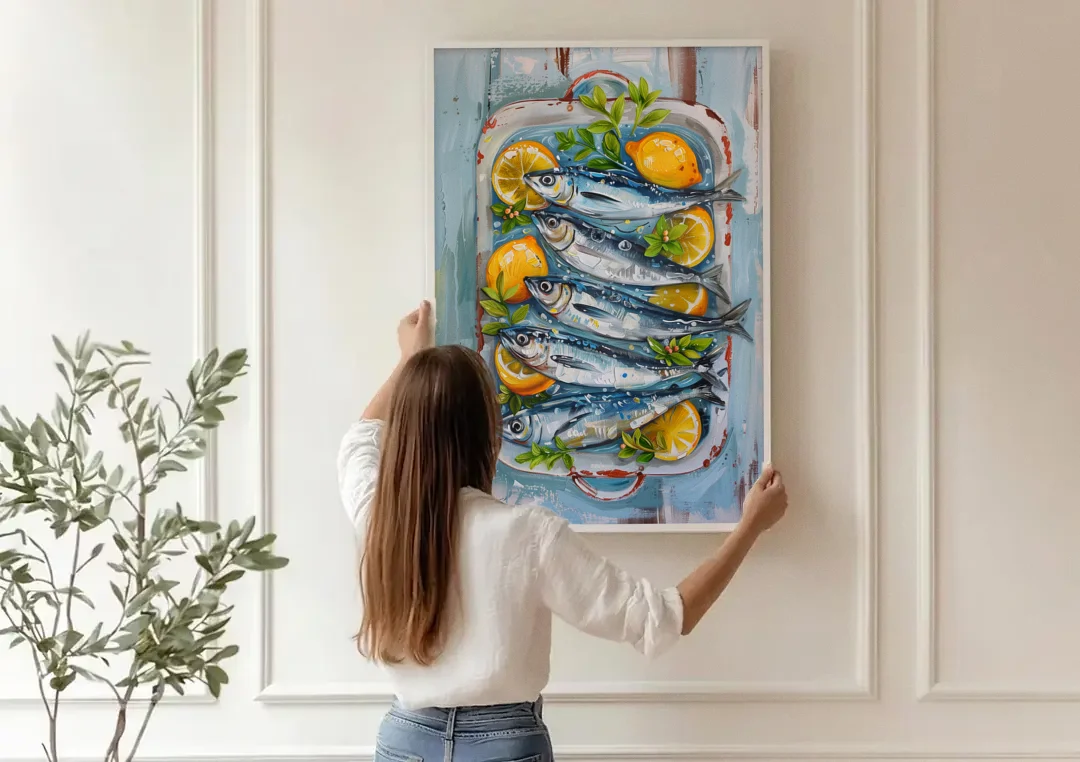 Sardines Painting with Lemon Slices canvas wall art being hung on a paneled wall