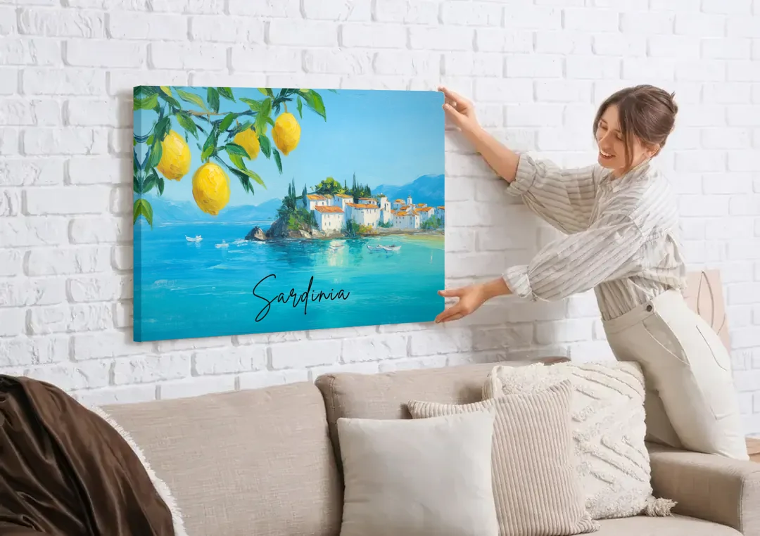 Sardinia Art with Lemon Branches canvas wall art being hung on a white brick wall above a sofa