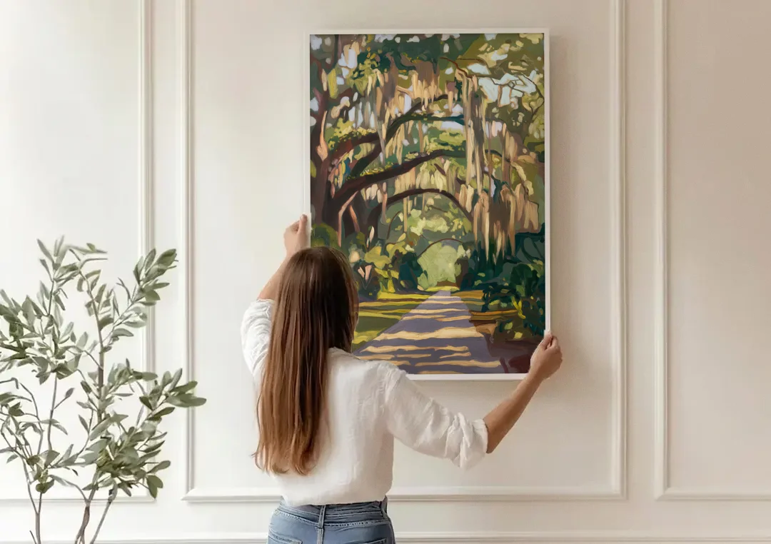 Savannah Oak Trees and Moss canvas wall art being hung on a paneled wall