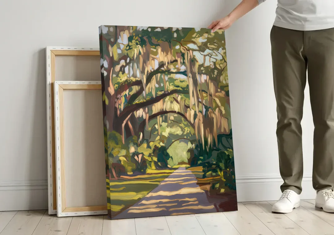 Savannah Oak Trees and Moss canvas wall art leaning against a wall next to blank canvases